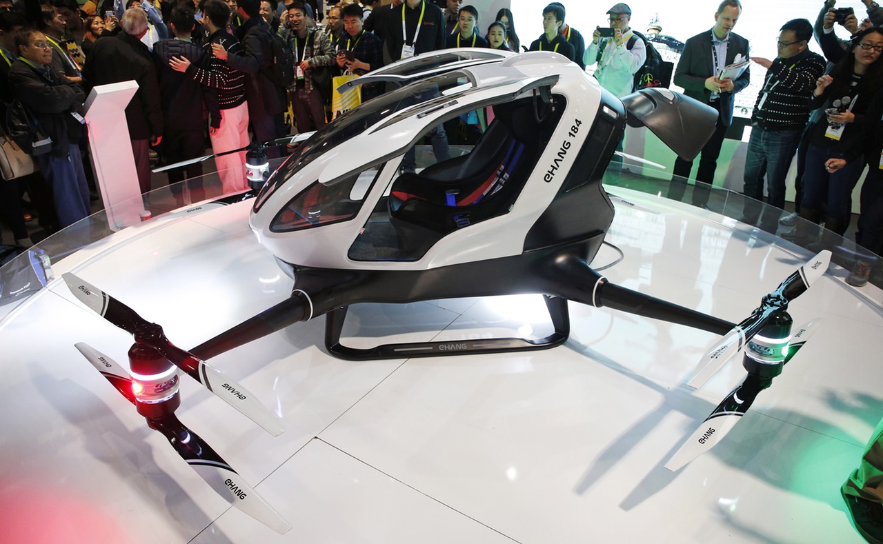 The EHang 184 autonomous aerial vehicle is unveiled at the EHang booth at CES International, Wednesday, Jan. 6, 2016, in Las Vegas. The drone is large enough to fit a human passenger. (AP Photo/John Locher)
